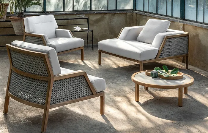 grand life coffee table round with grand life armchair and lounge armchair