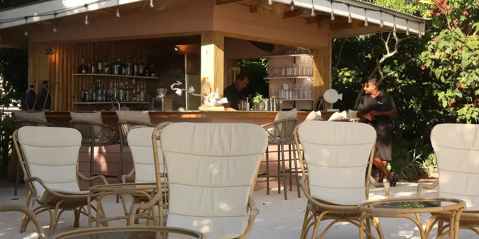 Outdoor Bar with rattan high back lounge seating with white comfy custions, Le Repaire Boutique Hotel & Restuarant, Seychelles